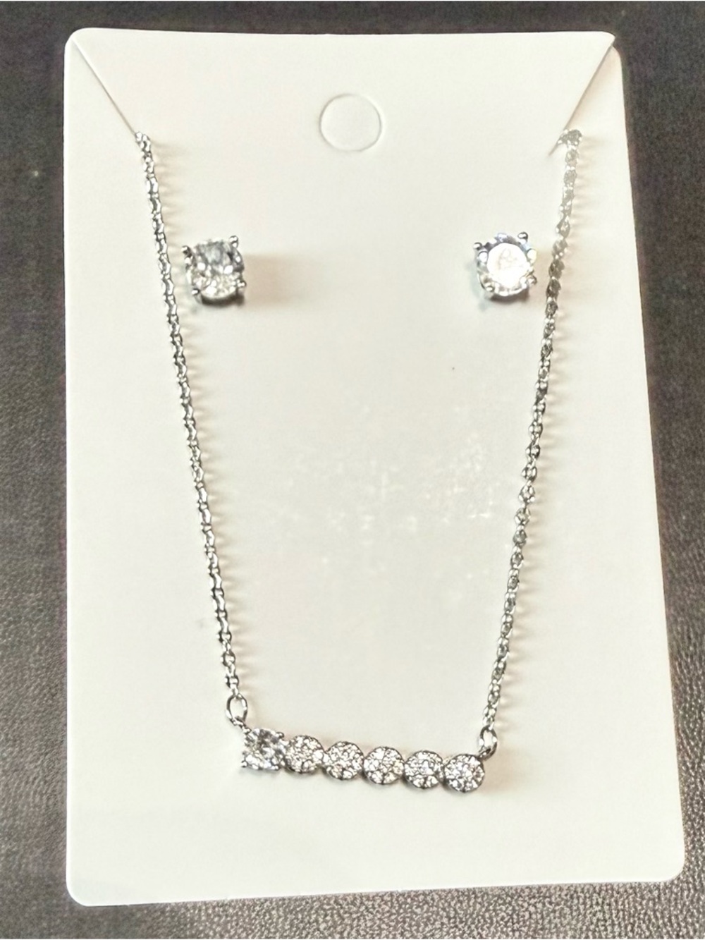 Platted silver necklace and earrings set.